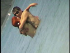 Beach spy cam catches a readhead girl running into the water