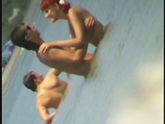 Beach spy cam catches a readhead girl running into the water