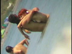 Beach spy cam catches a readhead girl running into the water