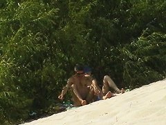 Nudist beach voyeur vid with a hot brunette milf