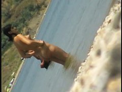 Crazy chicks don't hesitate to tan completely naked at the public beach