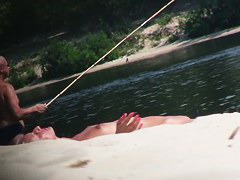 Hot nude blonde sunbathing filmed by hidden beach camera