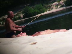 Hot nude blonde sunbathing filmed by hidden beach camera