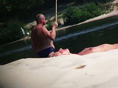 Hot nude blonde sunbathing filmed by hidden beach camera
