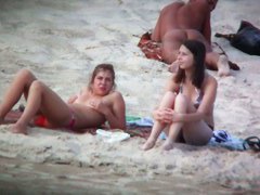Beach spy voyeur captures two friends sunbathing topless