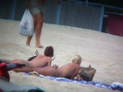 Beach spy voyeur captures two friends sunbathing topless