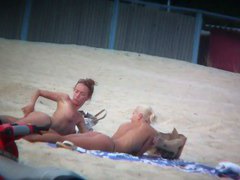 Beach spy voyeur captures two friends sunbathing topless