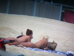 Beach spy voyeur captures two friends sunbathing topless