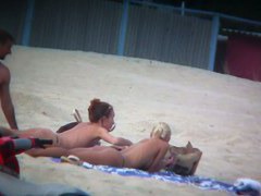 Beach spy voyeur captures two friends sunbathing topless