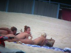 Beach spy voyeur captures two friends sunbathing topless