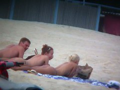 Beach spy voyeur captures two friends sunbathing topless
