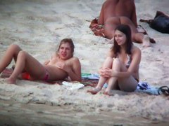 Beach spy voyeur captures two friends sunbathing topless