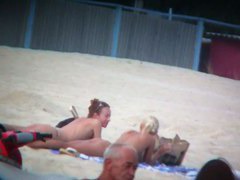 Beach spy voyeur captures two friends sunbathing topless