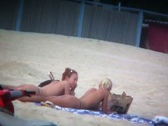 Beach spy voyeur captures two friends sunbathing topless