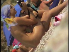 Candid beach shots of girls fooling around with their camera