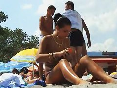 Sexy beach nudist women putting on lotion caught by spy cam
