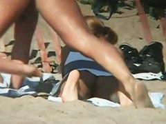 Tempting women sunbathing in a nude beach video