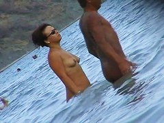 Nude beach voyeur scenes with amateurs bathing in the sea