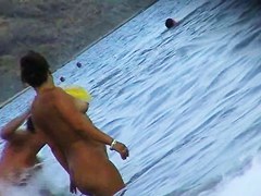 Nude beach voyeur scenes with amateurs bathing in the sea