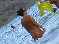 Nude beach voyeur scenes with amateurs bathing in the sea