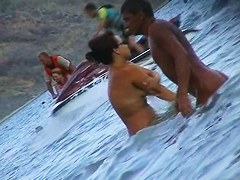 Nude beach voyeur scenes with amateurs bathing in the sea
