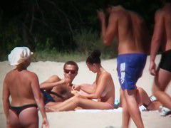 Huge boobed sexy ladies lie on the beach and relaxing