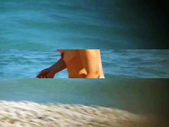 Hot mature beach nudist strips of her clothes and gets wet