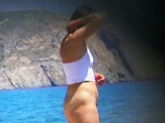 Hot mature beach nudist strips of her clothes and gets wet