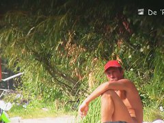 Hidden camera films beach nudist women tanning their bodies and big tits