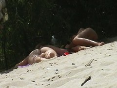 Two naked babes taking sunbaths in best nude beach video