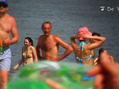 Semi nude, semi-regular beach with naked and dressed people