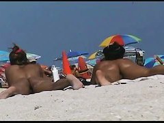 Amazing beach voyeur vid of two nudist girls and their wet pussies