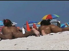 Amazing beach voyeur vid of two nudist girls and their wet pussies
