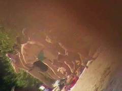 Cute brunette with black thong in the beach video