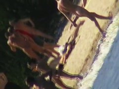 Cute brunette with black thong in the beach video
