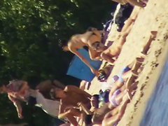 Cute brunette with black thong in the beach video