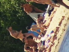Cute brunette with black thong in the beach video