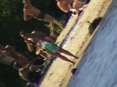 Cute brunette with black thong in the beach video