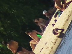Cute brunette with black thong in the beach video