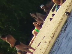 Cute brunette with black thong in the beach video
