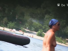 Mature fems get their nudist bodies spied by beach hunter