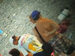 Some teen and mature couples resting at the nudist beach