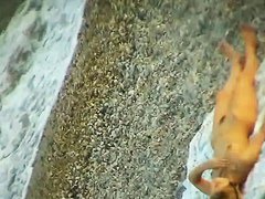 Some teen and mature couples resting at the nudist beach