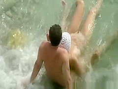 Nudist woman with small tattoo and trimmed pussy