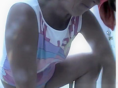 Chubby woman takes off her swimsuit