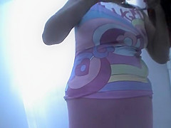 Chubby woman takes off her swimsuit