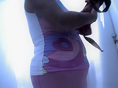 Chubby woman takes off her swimsuit