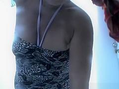 Chubby woman takes off her swimsuit