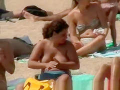 Blonde tourist with perky tits at beach