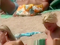 Blonde tourist with perky tits at beach